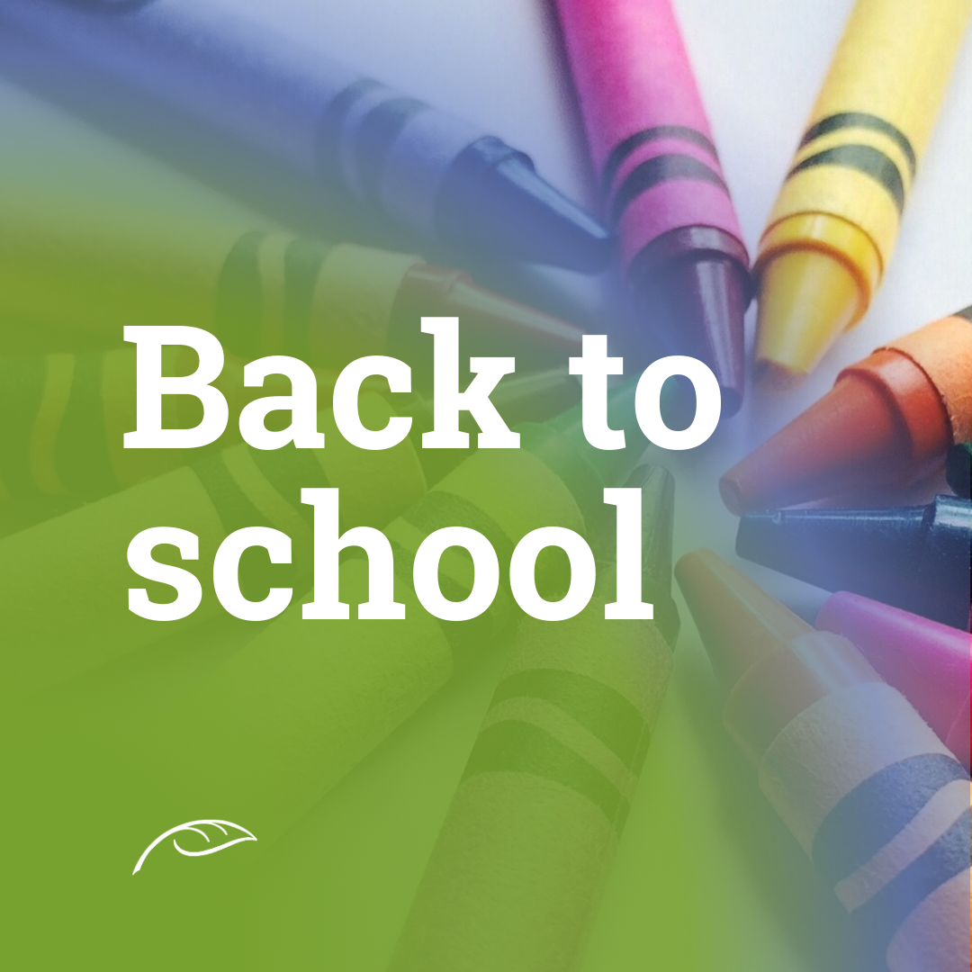 Promotional graphic reading “Back to School” in large white text over a close-up background of colorful crayons.